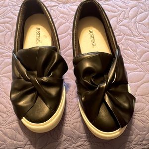 Black shoes with bows.